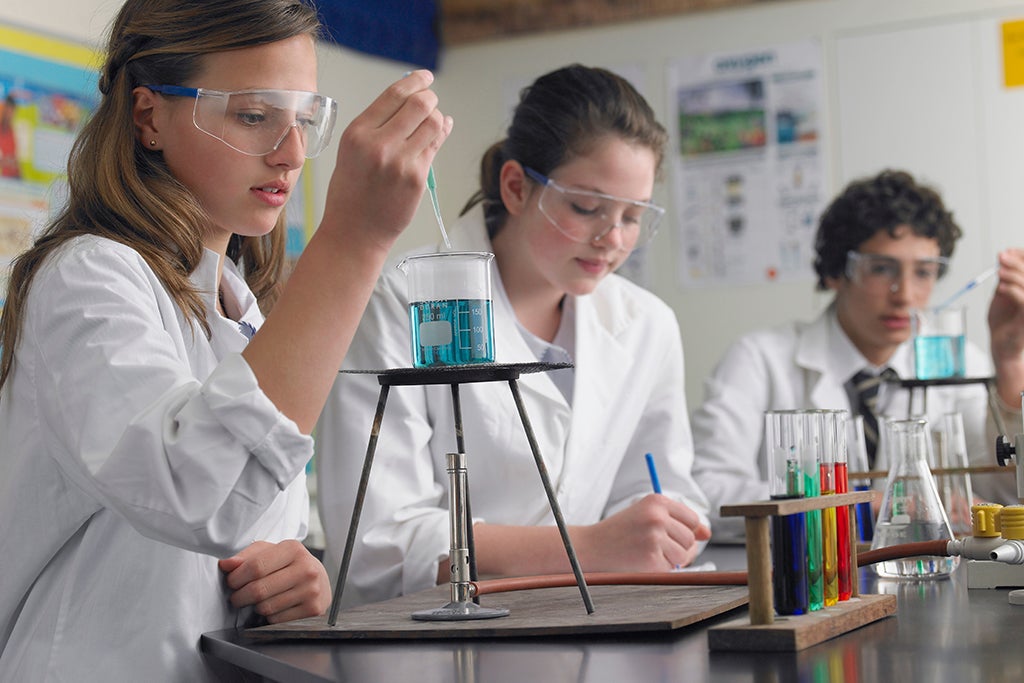 Students conduct experiments in chemistry lab